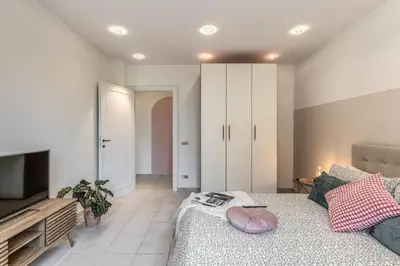 a living room with a couch and a television at La Casa di Cesare in Rome