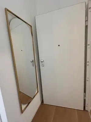 a bathroom with a mirror and a white door at Momenti di felicità a Roma in Rome