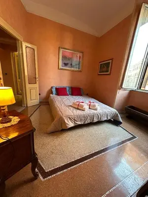 a bedroom with a bed with two pillows on it at L'Angolo di Roma in Rome