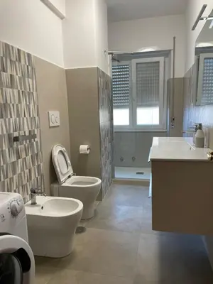 a bathroom with a tub and a toilet and a sink at Vatican Apartment Cipro in Rome