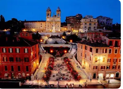 a view of a large plaza in a city at night at Carrozze Suite in Rome