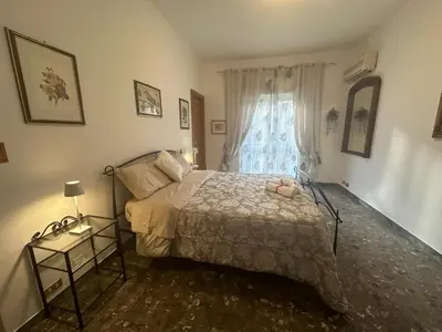 a bedroom with a bed and a window at La Casa oltre il Parco in Rome