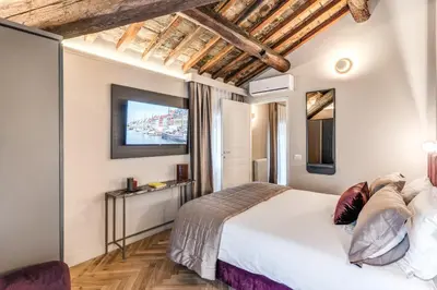 a bedroom with a large bed and a window at Palazzo Ottavia - La Maison D'art Collection in Rome