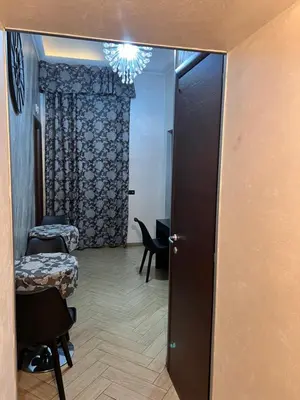 a door leading to a room with a table and chairs at Funny place in Rome