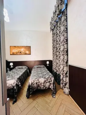 a room with two beds and a curtain at Funny place in Rome