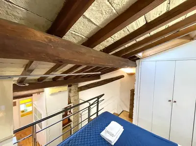 a room with a blue table in a room at Trastevere Lovely Loft in Rome