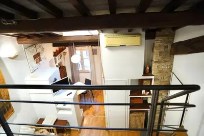 a view from the top of a staircase in a room at Trastevere Lovely Loft in Rome