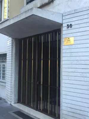a building with a door with bars on it at B&B Classy Rome in Rome