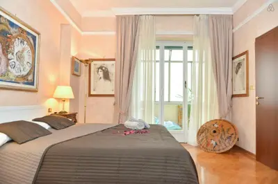a bedroom with a large bed and a window at B&B Classy Rome in Rome