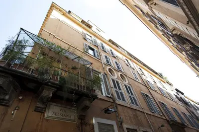a building with a balcony on the side of it at Casa Belsiana in Rome