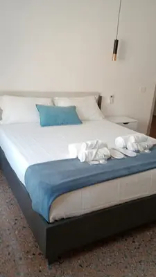a large bed with white towels on top of it at Vacanze Romane da Manuela in Rome