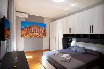 a bedroom with a bed with towels on it at Appartamento a 2 passi da San Pietro in Rome