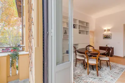 a room with a table and chairs and a dining room at Contemporary Flat in Trastevere in Rome