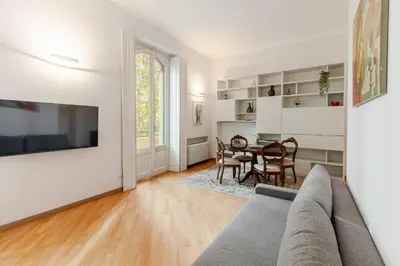 a living room with a couch and a table at Contemporary Flat in Trastevere in Rome