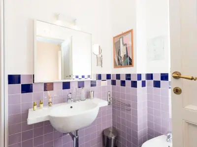 a bathroom with a sink and a toilet at Vatican Comfortable Sunny Apartment in Rome