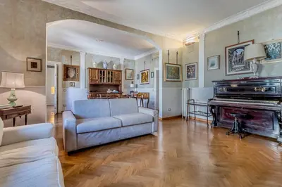 a living room with a couch and a piano at Roman Holiday Repubblica in Rome