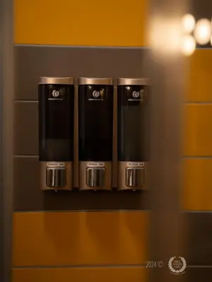 a shelf with four coffee cups on it at DeaSuites One in Rome