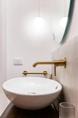 a bathroom with a white sink and a mirror at Rome Golden Retreat in Rome