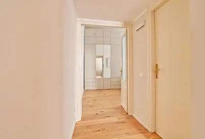 an empty corridor of an empty apartment with a hallway at Boncompagni79 design & comfort in the City Center Villa Borghese in Rome
