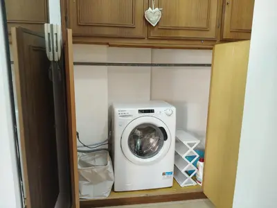 a washer and dryer in a small room at Gemelli-St Peter Sweet House in Rome