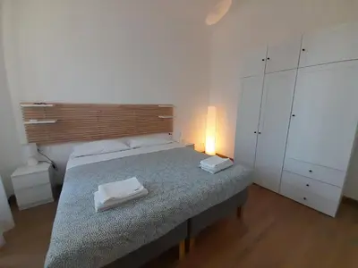 a bedroom with a bed with two towels on it at Acche Apartments in Rome
