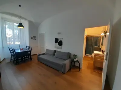 a living room with a couch and a table at Acche Apartments in Rome