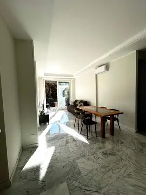 a living room with a table and a couch at Domus Romae in Rome