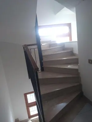 a staircase in a house with wooden steps at YourStay@Rome Vatican in Rome