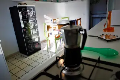 a kitchen counter with a blender on a counter top at Heartwarming Apartment in ROMA - 5 Minutes from Colosseum in Rome