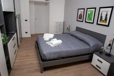 a bedroom with a bed with towels on it at Ostiense 73 in Rome