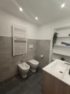 a bathroom with a toilet and a bidet and a sink at Appartamento Lilly's Home Piazza Navona in Rome