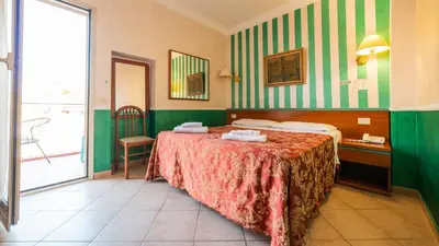 a hotel room with a bed and a balcony at Hotel Center 3 in Rome