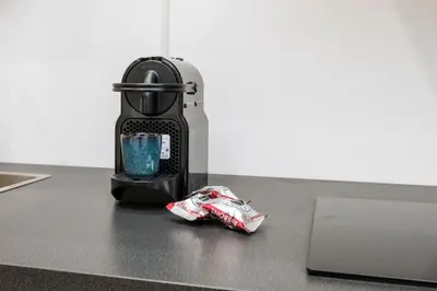 a blender sitting on a counter next to a laptop at Zen Vatican Studio - Zen 30 in Rome
