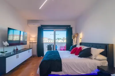 a bedroom with a large bed and a window at Aim - La Cupola - Saint Peter view apartment in Rome