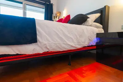 a bed with pillows on it in a room at Aim - La Cupola - Saint Peter view apartment in Rome