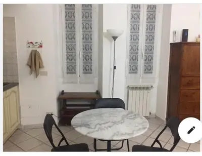 a room with a table and chairs and a table and a table and chairs at Casa Adry in Rome