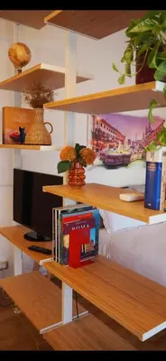 a room with a desk with a computer and books at Casa Aurelia 641 in Rome