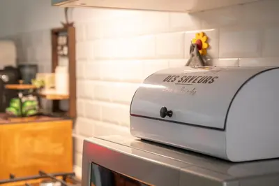 a white toaster sitting on top of a counter at Olimpia House - Gianicolense in Rome