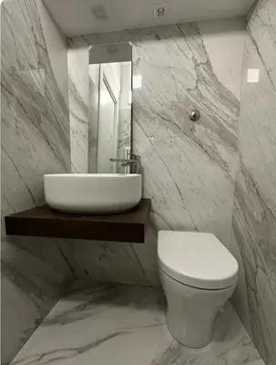 a bathroom with a sink and a toilet and a mirror at Home34 in Rome