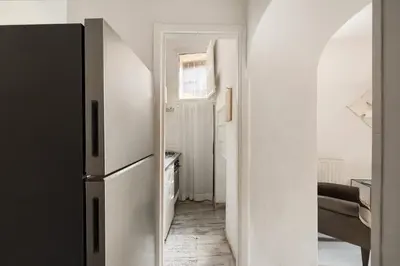 a kitchen with a refrigerator in a room at Navona Charming Apartment by Romeloft in Rome