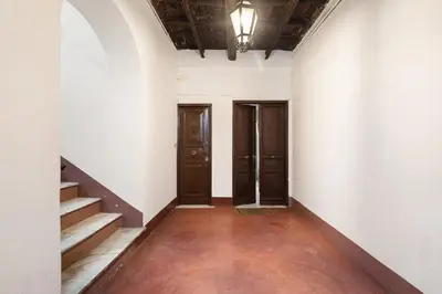 an empty hallway with two doors and stairs at Navona Charming Apartment by Romeloft in Rome