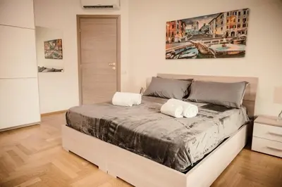 a bedroom with a bed with two towels on it at Dea Suites Two in Rome