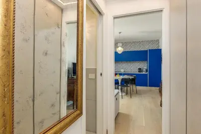 a mirror in a hallway with a dining room at Easylife - Vatican Terrace Apartment in Rome