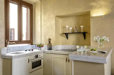 a kitchen with a sink and a window at Spanish Steps Boutique Apartment in Rome