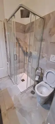 a bathroom with a shower with a toilet in it at Machiavelli Forty Seven in Rome