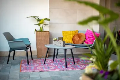 a living room with a couch and a table and chairs at Twins Royal Suite in Rome