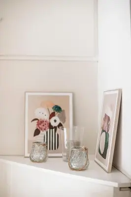 a shelf with a picture and three vases on it at Casina Bianca in Rome