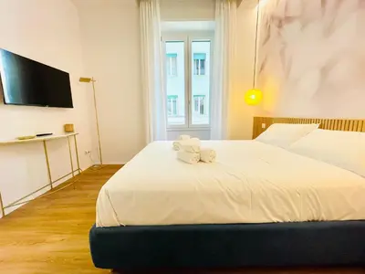 a bedroom with a bed with a teddy bear on it at Rome Riverside Retreat in Rome