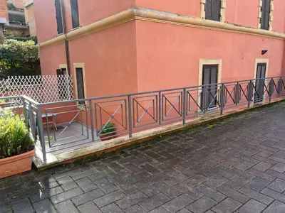 a metal railing on the side of a building at Domus del Vicario in Rome
