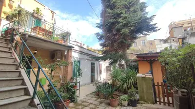 a street in an old town with stairs and plants at Roma Brancaleone Loft, Metro C in Rome